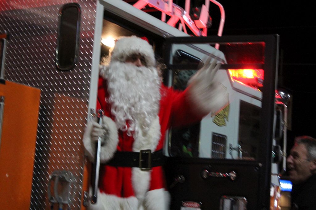 Santa Arrives On The Fire Truck