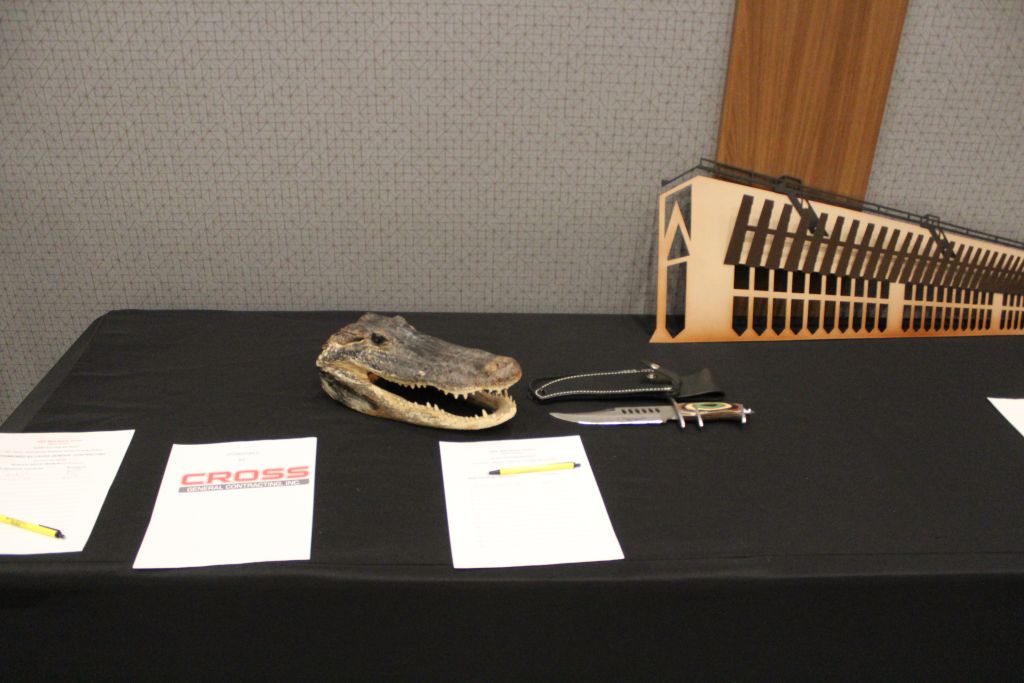 A sweet knife and gator head were also auctioned off